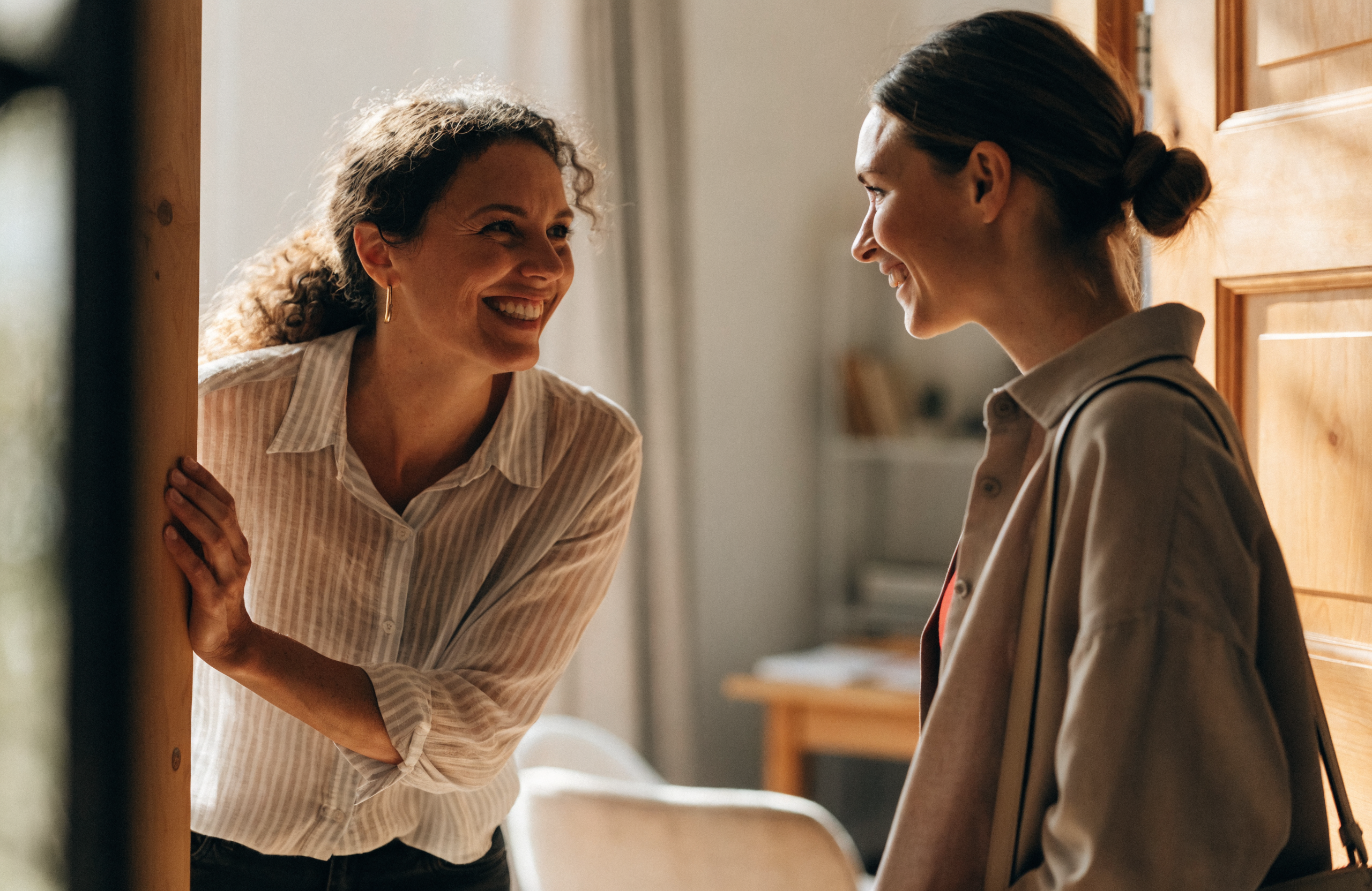 A professional welcoming a returning client